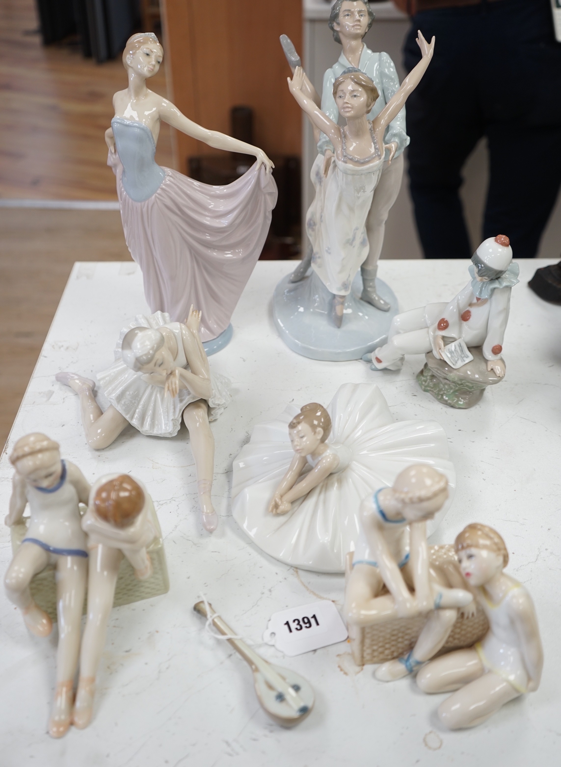 Seven various ceramic figures including Lladro, Nao and Doulton, tallest 33cm